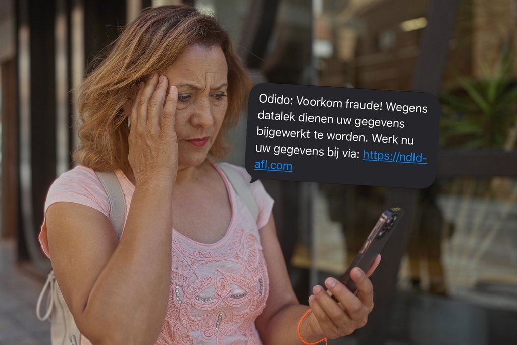Valse Odido-sms naast bezorgde vrouw